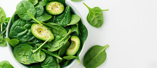 Aufkleber - A vegan healthy avocado and spinach salad is set against a white background with ample copy space image