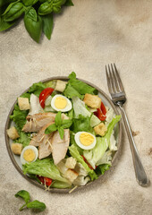 Wall Mural - Caesar salad with chicken and quail eggs