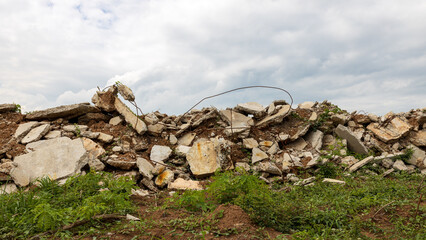 Wall Mural - A low angle view of the many concrete ruins that have been demolished.