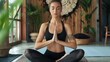 © Mirjana - Woman meditating in yoga pose with eyes closed in a room with plants