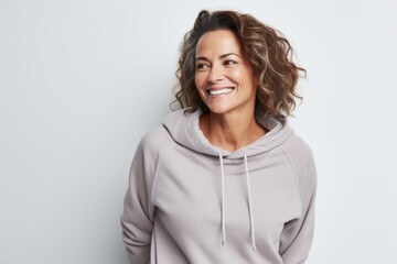 Poster - Portrait of a happy woman in her 40s dressed in a comfy fleece pullover isolated in white background