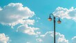 © chanidapa - Street lamp post with a partly cloudy sky, patches of blue