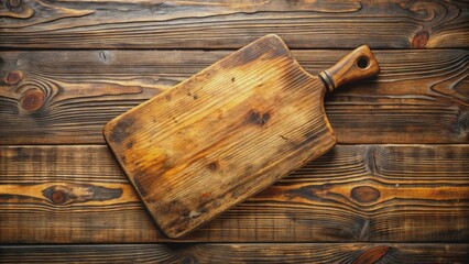 Vintage wooden cutting board with scars and cracks worn from years of use lies empty on a rustic wooden table, awaiting new recipes and stories.