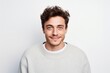 © Markus Schröder - Portrait of a satisfied man in his 20s dressed in a warm wool sweater over white background