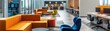 © Rattanathip - Modern open office space with vibrant furniture and workstations, featuring comfortable seating and a collaborative environment.