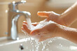 © wasan - Person washing hands with soap, representing personal hygiene