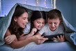 © Lumeez23/peopleimages.com - Home, bedroom and babysitter with kids, tablet and typing with entertainment, ebook and online games. Apartment, night or nanny with children, tech or digital app for fun, live streaming or happiness