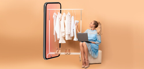 Poster - Woman Shopping Online Using Laptop Sitting Near Big Smartphone Choosing Clothes On Rail Over Beige Studio Background. Ecommerce, Fashion And Technology. Collage, Panorama