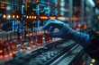 © Vilaysack - Scientist with gloves handling test tubes in a high-tech laboratory filled with computer screens and scientific equipment.