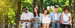 © Prostock-studio - Education concept. Group of college students with laptop and tablet computer studying together outdoors in campus, sitting on bench outside