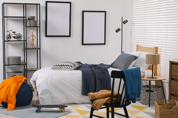 Poster - Teen's room interior with modern furniture and empty frames on wall