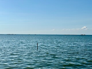 the sea stretches as far as the eye can see.