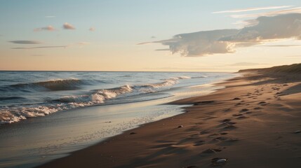 Wall Mural - The beach is calm and peaceful with the sun setting in the background