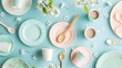 © matoya - Pastel Plates and Cups on a Blue Background