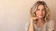 © Kate - beauty portrait of a smiling woman 45 years old with gray hair on a  neutral background, concept of natural female beauty and skin care, copy space