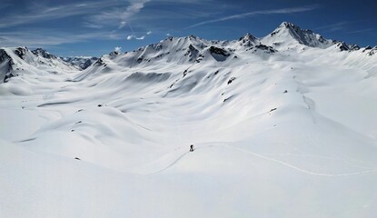 Ski tour to the summit of Flüela Wisshorn above Davos in a wonderful mountain world. Ski mountaineering in the Swiss Davos Klosters Mountains. Skitour in the snow covered mountains. High quality photo