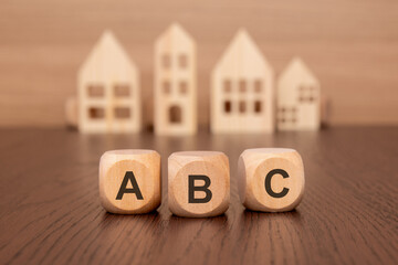 Sticker - cubes with message ABC surrounded by wood home. Always Be Closing concept