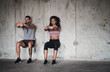 © aLListar/peopleimages.com - Couple, fitness and squat for exercise outdoor, muscle development and balance support of training. Woman, man and workout progress, bodybuilder and cardio resilience of wellness performance