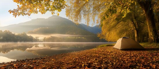 Canvas Print - A tent is set up on a beach next to a lake