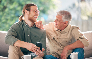 Wall Mural - Senior, father and man with smartphone for relax on sofa, communication and show dad social media meme. Laughing, son and couch in home with mobile phone for connection, learning and family time.