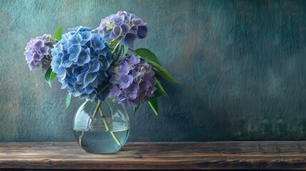 Canvas Print - Garden hydrangeas in a plain glass vase on a wooden table