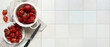 © Pixel-Shot - Colander and plate with fresh sweet strawberries on white tile background