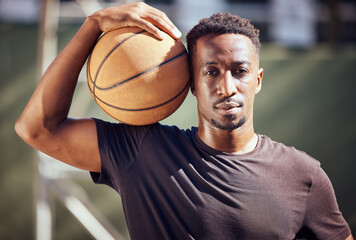 Sticker - Portrait african american man standing with a basketball on the court. Fitness male athlete or player holding a sports ball after playing, training and practice game in the background on a court