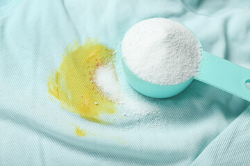 Wall Mural - Laundry detergent on stained clothes, closeup