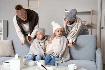 Canvas Print - Parents giving medications to their ill little daughters at home