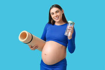 Poster - Happy pregnant woman with yoga mat and bottle of water on color background