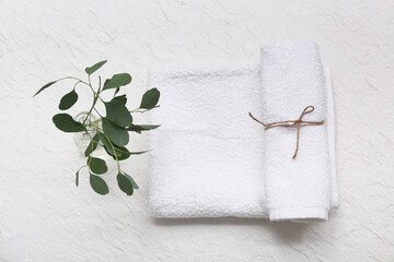 Sticker - Composition with clean soft towels and plant on white background