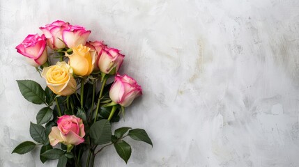 Poster - Pink and yellow rose bouquet on white wall background with copy space