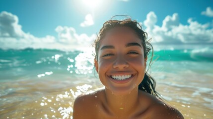 Cheerful Latina woman with a big smile, standing in knee-deep water at the beach, with golden sand and turquoise waves around her, and the sun shining brightly above