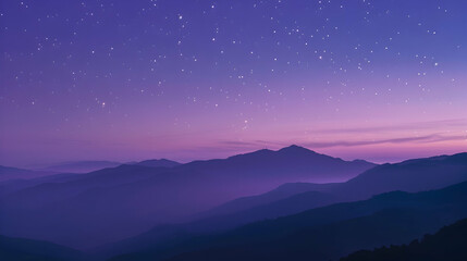Wall Mural - A serene evening over a mountain range with stars beginning to twinkle in the purple sky