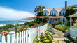 © Pretty Panda - Coastal cottage exterior with white picket fence, blooming garden, and wraparound porch overlooking a serene beach