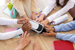 © Pixel-Shot - Female teacher and little pupils with VR glasses at table in classroom, closeup