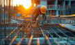 © serg3d - A construction worker lays down rebar for a new building. AI.