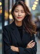 © K silver - Confident Young Woman in a Black Blazer