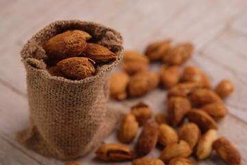 roasted almonds. Almonds are part of the Prunoidae subfamily of the Rosaceae family. This plant is in the same classification as peaches in the subgenus Amygdalus within Prunus. Prunus dulcis