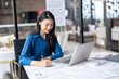 © Charlie's - Beautiful Business Woman working by using laptop computer Hands typing on keyboard. Professional investor working new start up project. business planning in office. Technology business