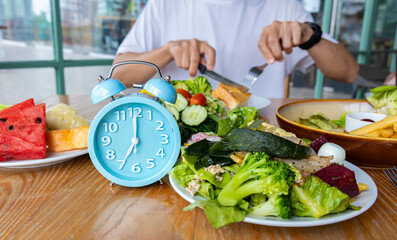 Wall Mural - Alarm clock with IF (Intermittent Fasting) 16 and 8 diet rule and weight loss concept.-Diet plan concept