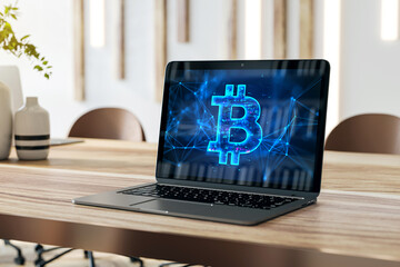 Poster - Close up of laptop on wooden desk with digital bitcoin sign on blurry background. Digital banking, technology and cryptocurrency concept. 3D Rendering.