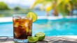 © Li - Refreshing Cuba Libre Cocktail with Ice Cubes and Lime, Poolside View