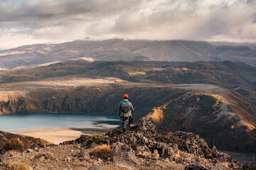 Sticker - Traveler man standing on top of mountain and Tama Lakes at Tongariro national park, New Zealand