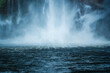 © Mumemories - Moody waterfall flowing in tropical rainforest at Milford Sound
