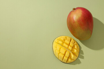 Wall Mural - Ripe delicious mango on a light background