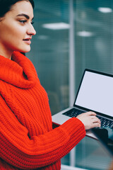 Fototapete - Successful group of graphic designers in casual wear discussing profile on website holding modern laptop with blank screen area for your internet content.Team of young people collaborating on app