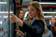 © GustavsMD - A confident businesswoman presenting data on an interactive touchscreen to her colleagues, emphasizing teamwork and modern office technology.