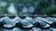 © svastix - Detailed image of raindrops falling and splashing on roof tiles, captured in close-up, creating a visual of water droplets in motion during a rainy day.