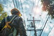 © Mohamad - Technician wearing a harness while working on a power line